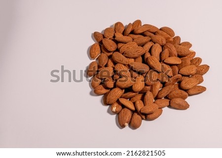 High Angle View Of Almonds On White Background - stock photo