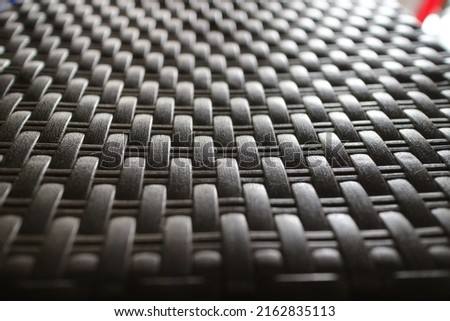 Black woven plastic with a light shine effect. Hard material for 3 dimension rendering for architectural purposes