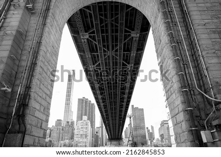 Low angle view of Queensboro bridge at New York city.  Black and white photo.