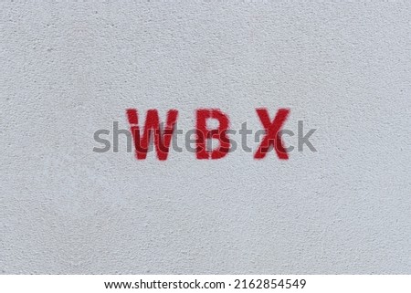 RED WBX on the white wall. Spray paint.
