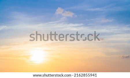 Romantic Golden sunset Sky in Summer season with bright Yellow, Orange, blue sunrise Clouds Backgrounds 