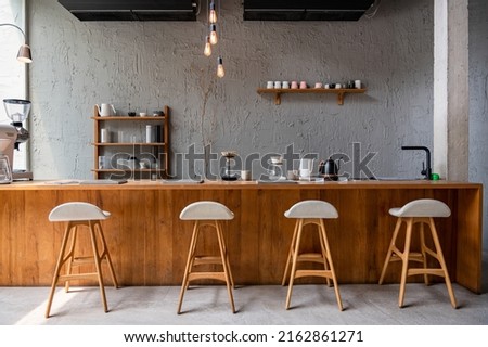 The layout in a dark loft style opens up inside the cafes. welcome to open coffee shop background Royalty-Free Stock Photo #2162861271