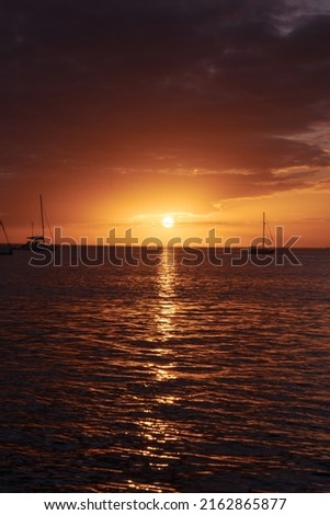 Beautiful sunset by the ocean beach with boats sailing on the sea in Key Biscayne, Miami , Florida Royalty-Free Stock Photo #2162865877