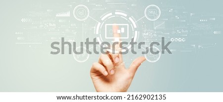 Stock trading theme with hand pressing a button on a technology screen