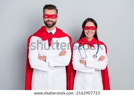 Portrait of two attractive cheerful docs super team career folded arms save life isolated over grey color pastel background Royalty-Free Stock Photo #2162907723