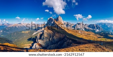 Seceda in autumn in South Tyrol in the Alps of North Italy. Views from Seceda over the Odle mountains in autumn with fall colors. Seceda, Val Gardena, Trentino Alto Adige, South Tyrol in Italy. Royalty-Free Stock Photo #2162912567