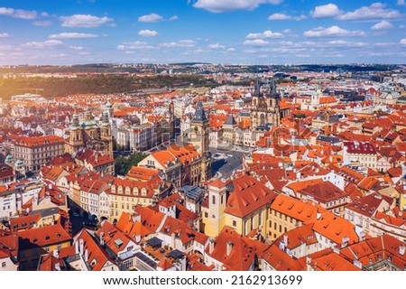 Prague beautiful panoramic sunny aerial drone view above Prague Old Town Square with Church of Our Lady before Tyn and Prague Astronomical Clock Tower. Drone flight over red roofs of Prague, Czechia. Royalty-Free Stock Photo #2162913699