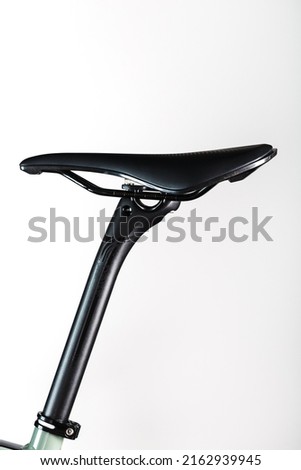 Bicycle saddle on a light background accessories for bike repair and tuning Royalty-Free Stock Photo #2162939945
