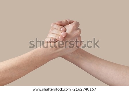 Two man and woman handshake grip hand on beige. Royalty-Free Stock Photo #2162940167