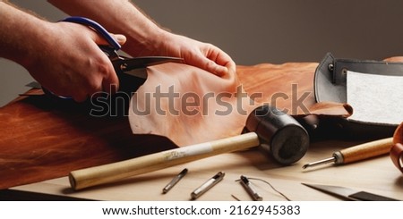 composition of isinstruments for leather processing. the process of manufacturing leather goods. Royalty-Free Stock Photo #2162945383