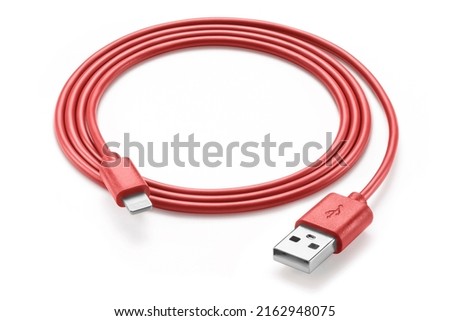 Red simple USB Apple cable, rolled up, isolated on white background