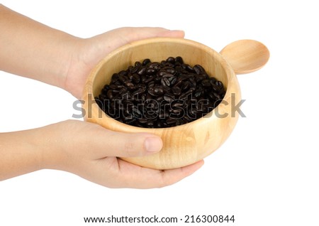 Image of coffee bean in wooden bowl on white background