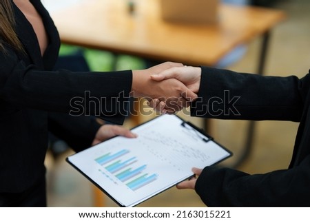 Business partnership meeting concept. Image business woman handshake. Successful business people handshaking after good deal. Group support concept. Royalty-Free Stock Photo #2163015221