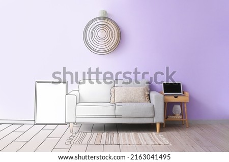 Sofa and table in living room with lilac wall. Interior design