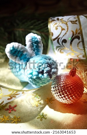 New Year decorations. Christmas card with funny toy bunny with ball. Happy new year 