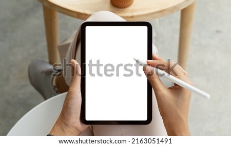 using stylus pen on digital tablet first person view Royalty-Free Stock Photo #2163051491