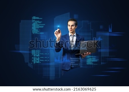 Attractive young european business man with laptop standing on abstract blue background with coding and tech information. Database, cloud computing and science concept. Double exposure