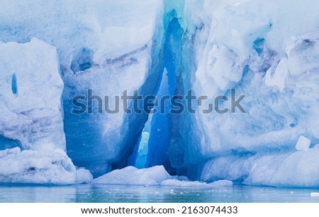 Iceberg with a blue hale cave