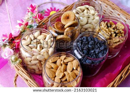 Mixed nuts and dried fruits, Nuts and Dry Fruits, Healthy snack - mix of organic nuts and dry fruits, dry fruits. Royalty-Free Stock Photo #2163103021