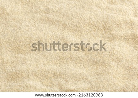 Close up of uncooked semolina flour background Royalty-Free Stock Photo #2163120983