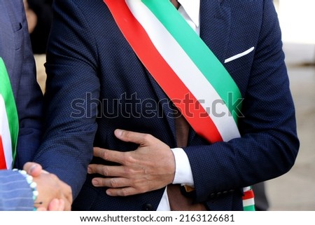 Close-up on the tricolor band of the Italian mayor. Italian politics, mayor elections Royalty-Free Stock Photo #2163126681