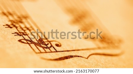 Macro image of treble clef and music notes. Copy space for design. Horizontal image.