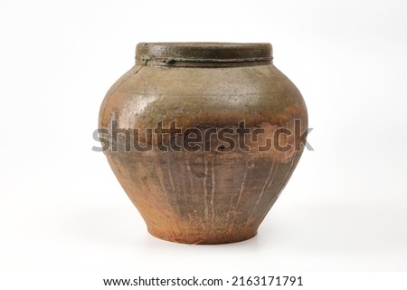 Vintage pottery, vase isolated on white background. Antique brown clay pot on white background. Royalty-Free Stock Photo #2163171791