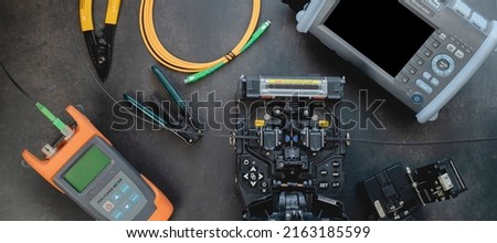 Fusion Splicing Tool, a set of fiber-optic or fiber-optic splicers for high-speed Internet connections. Royalty-Free Stock Photo #2163185599