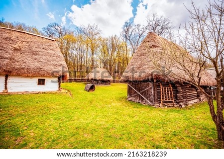 Wind mills from Astra old hause Museum Sibiu. Traditional rustic houses in Astra complex. Discover Romania. Old traditional farm., rustic house and dependencies