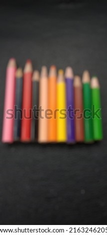 Defocused abstract background of colored pencils for coloring pictures at school