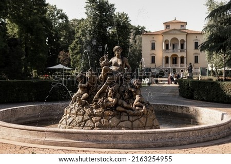 beautiful statue fountain on the territory of the chateau in italy