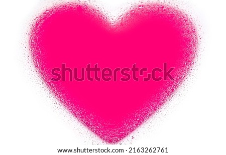Pink heart on white background with water drops on glass