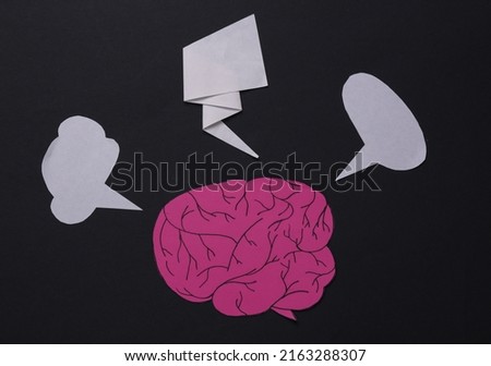 Thinking concept, chat, dialogue. Human brain cartoon with dialog bubbles on black background