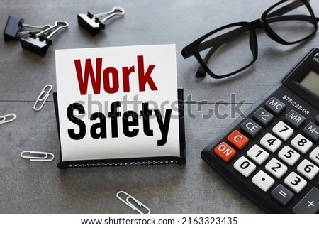 work safety. text on white paper in a business card