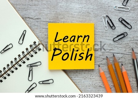 learn polish. text on yellow sticker on notepad Royalty-Free Stock Photo #2163323439