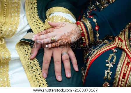 Henna Tattoo on Bride's Hand.Moroccan wedding preparation henna party. Temperate white mehndi. Modern mehendi art.

 Royalty-Free Stock Photo #2163373167