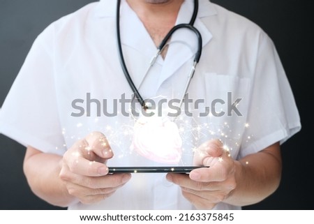 Doctor examines the heart hologram, verifies the test results on the virtual interface, and analyzes the data. Heart disease, myocardial infarction, breakthrough technology, and future medicine
