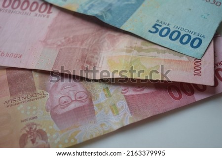denominations of one hundred thousand rupiah and fifty thousand rupiah issued by Bank Indonesia as a means of buying and selling transactions, Indonesian currency