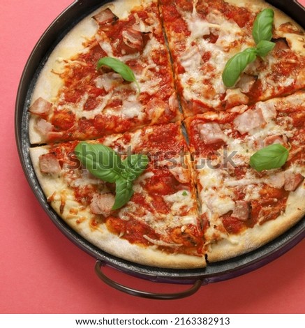 Pizza on pink background. Creative conception. Food delivery. Top view, flat lay, copy space