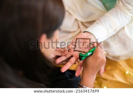 Indian traditional wedding henna mehendi mehndi hands close up Royalty-Free Stock Photo #2163417699