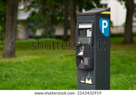 Modern parking meter outdoors. Space for text
