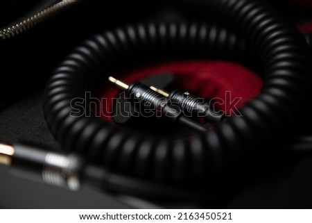 Aux cables for muscial equipment. Connect headphones with high fidelity cable. Curated collection of royalty free music images and photos for poster design template