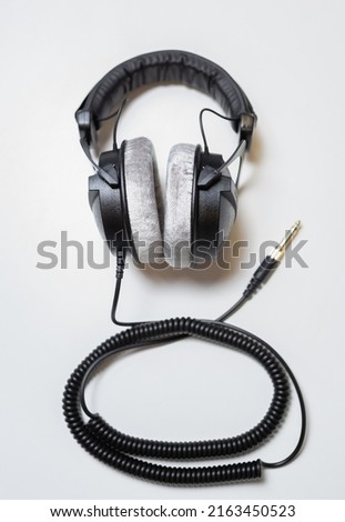 Professional dj headphones on white background. Listen to the music in high fidelity. Curated collection of royalty free music images and photos for poster design template