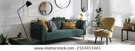 Modern living room interior with stylish comfortable sofa. Banner design Royalty-Free Stock Photo #2163451465