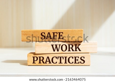 Wooden blocks with words 'Safe work practices'. Royalty-Free Stock Photo #2163464075