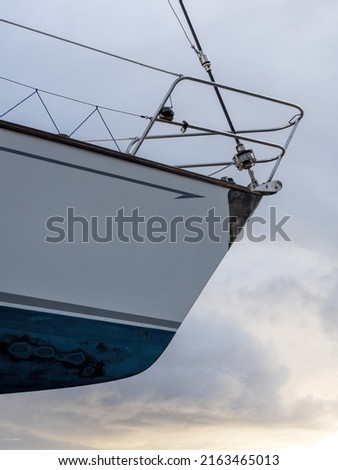 Low angle view of yacht bow with sky in background