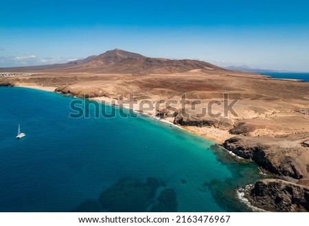 Scenic view of Papagayo Beach and the surrounding volcanic landscape in Costa Blanca, Yaiza, Lanzarote, Canary Islands, Spain Royalty-Free Stock Photo #2163476967