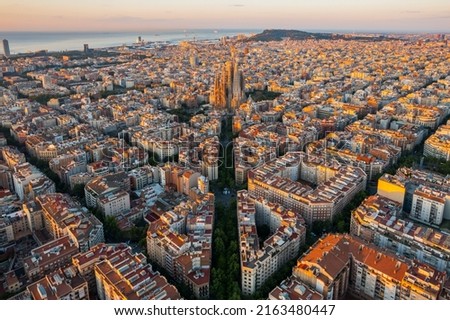 Aerial view of Barcelona Eixample residential district and Sagrada Familia Basilica at sunrise. Catalonia, Spain Royalty-Free Stock Photo #2163480447