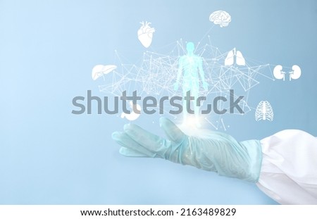 Doctor of medicine holds a hologram virtual interface electronic medical record. DNA. Digital healthcare network connection medical technology analysis, innovative and futuristic Royalty-Free Stock Photo #2163489829
