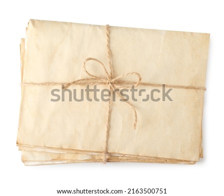 Stack of old letters wrapped with twine on white background, top view Royalty-Free Stock Photo #2163500751